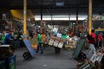 A vendor arrives with produce at the fruit market in Lima, Peru, on Thursday, May 11, 2023. According to economists, Peru's central bank is likely to keep its reference rate unchanged at 7.75% amid risks of high inflation expectations and political uncertainty.