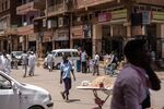Pedestrians walk down a main street in Khartoum, Sudan.