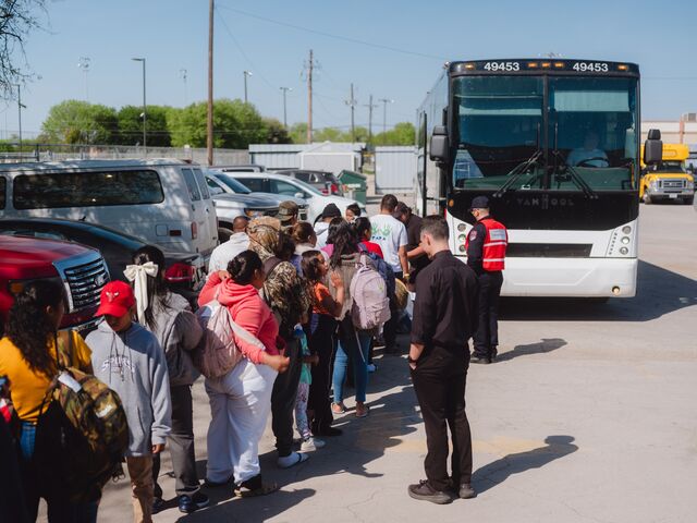 Migrants board a state sponsored bus to New York at Mission: Border Hope in Eagle Pass. 