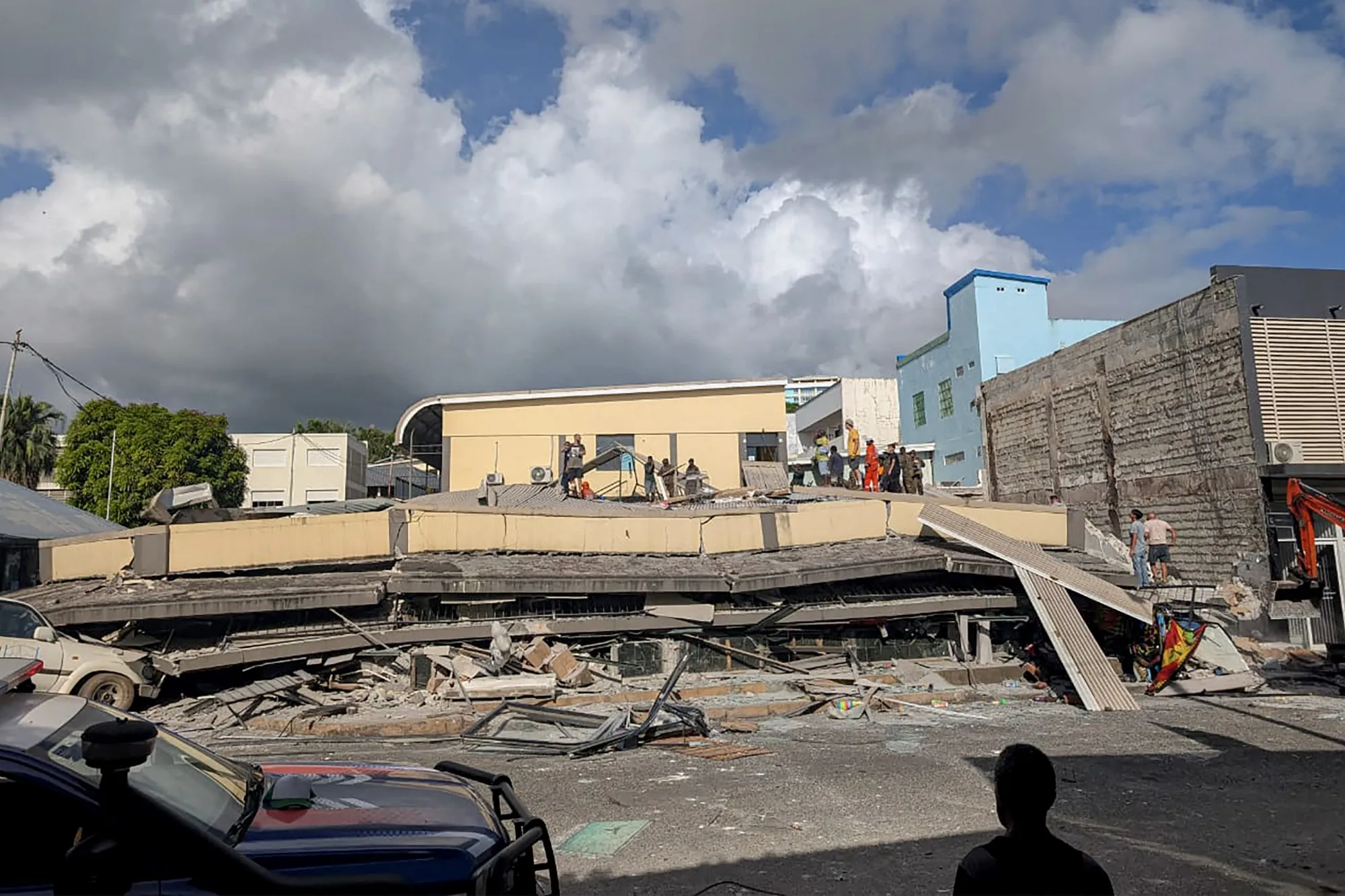 Rescue workers at the site of a collapsed building in Port Vila, Vanuatu, on Dec. 17.