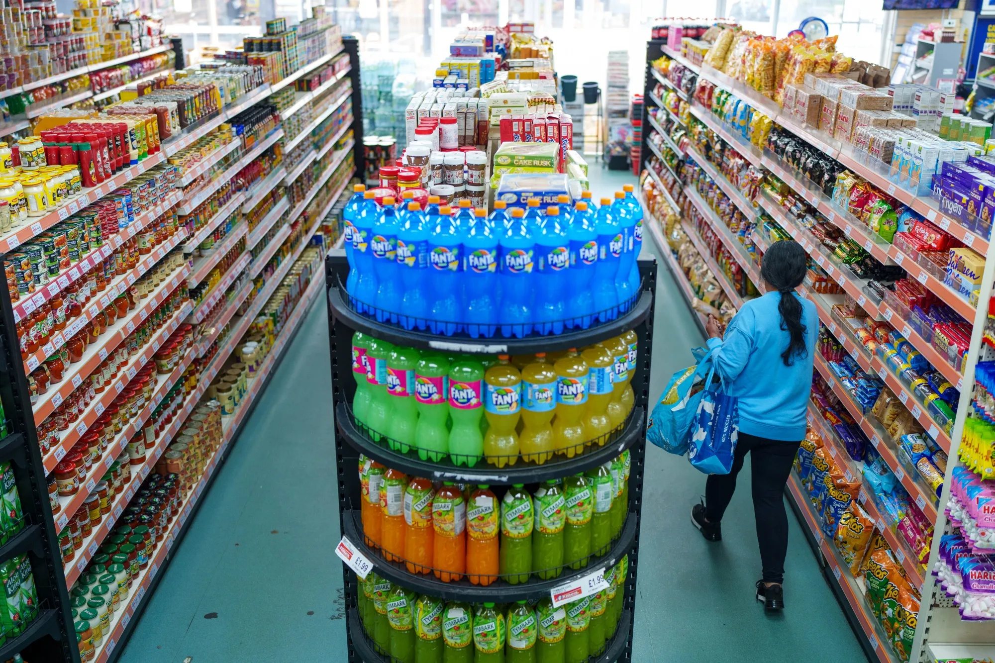 A shopper browses groceries at a supermarket in Sheffield, UK.