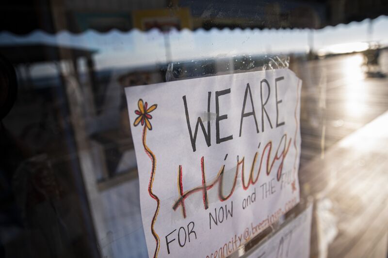 A "We Are Hiring" job posting at a store on the boardwalk in Ocean City, New Jersey, US