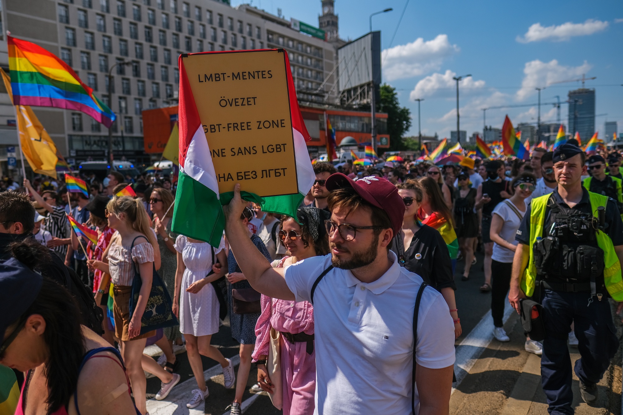 An activist holds a sign reading ‘LGBT-free zone’ in different languages during the Pride march in Warsaw, on June 19. 