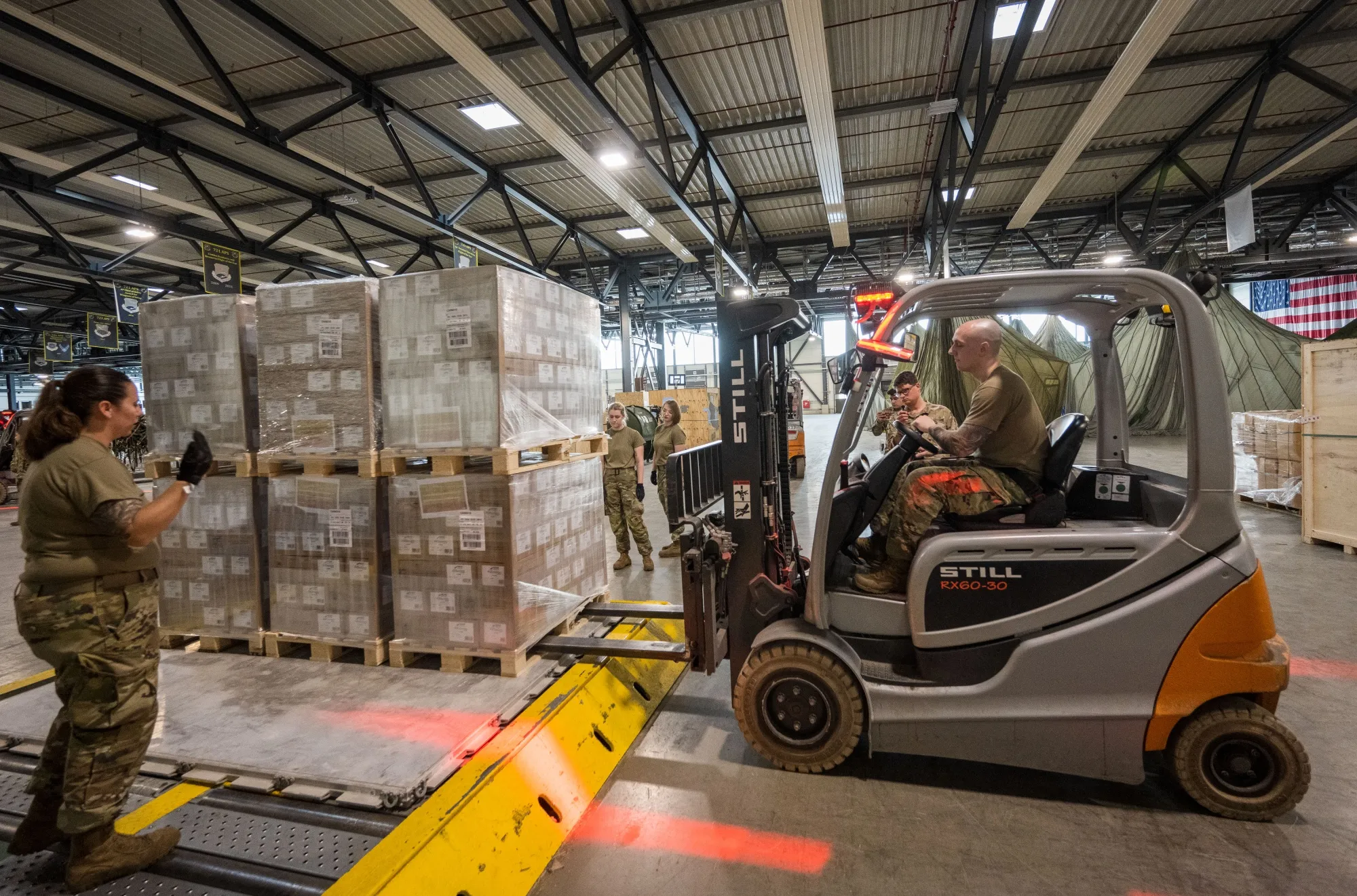 US Air Force crews&nbsp;load pallets with baby formula bound for the US, at Ramstein American Air Force base in Germany.