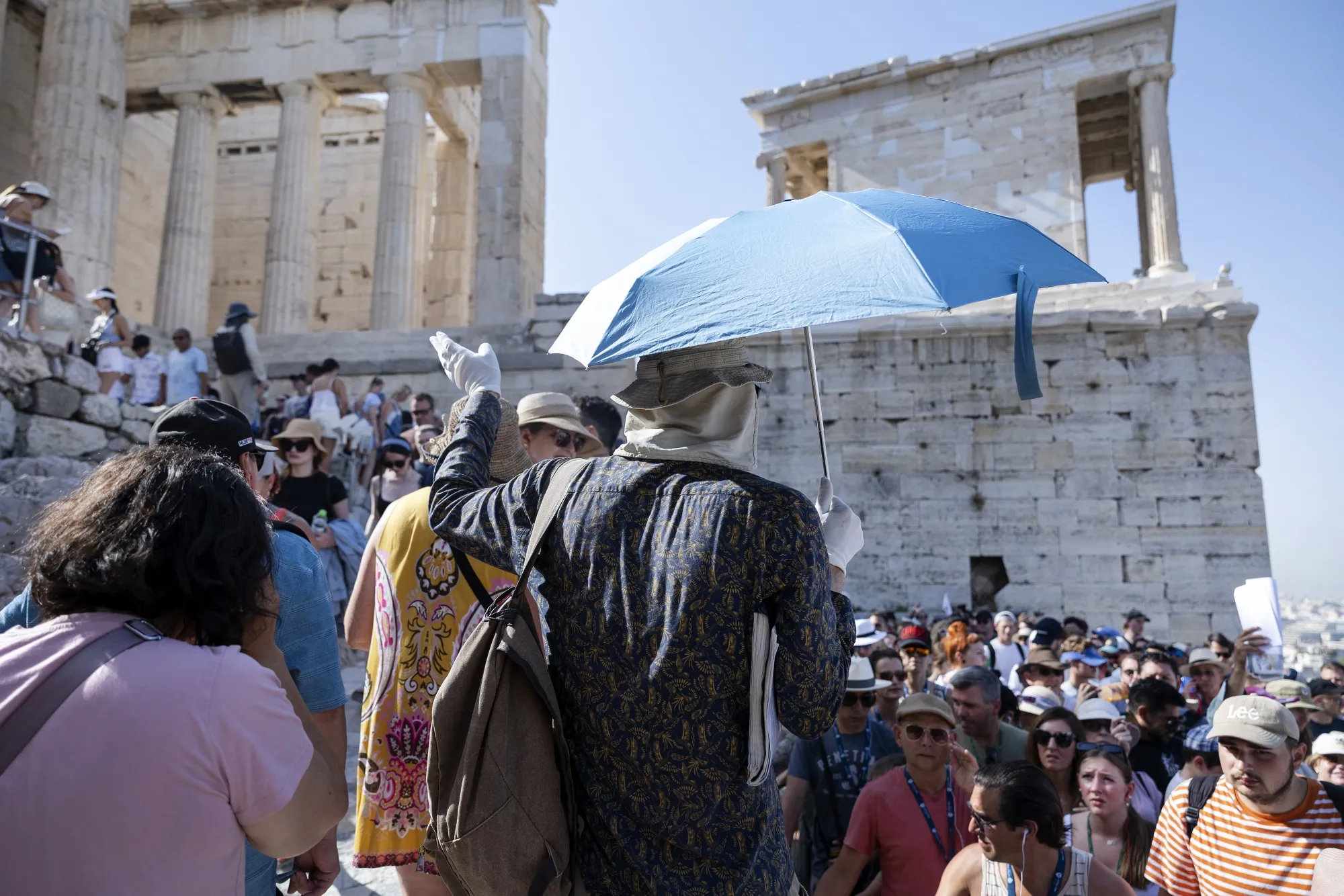 A tour guide leads a group at&nbsp;the Acropolis&nbsp;during extreme hot conditions&nbsp;in Athens&nbsp;on July 14.