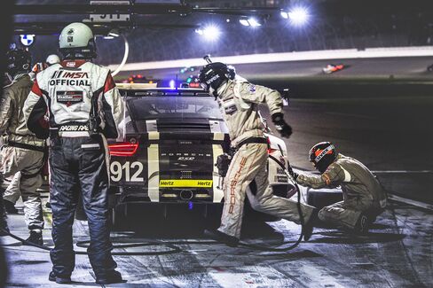 Pit crews work nonstop during the race.