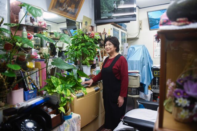 Matsuko Kido who runs a private barber for more than 30 years inside her shop. Iki Island in Nagasaki Prefecture, Japan on Thursday October 28, 2021. 