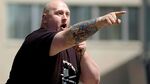 National Socialist Movement member Samuel Johnson, an organizer of illegal immigration rally in 2010 at the Veteran's Memorial in Austin, Minnesota, shouts at pro immigration protesters.
