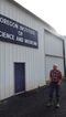 Arthur Robinson in front of one of his laboratory buildings in rural Oregon.
