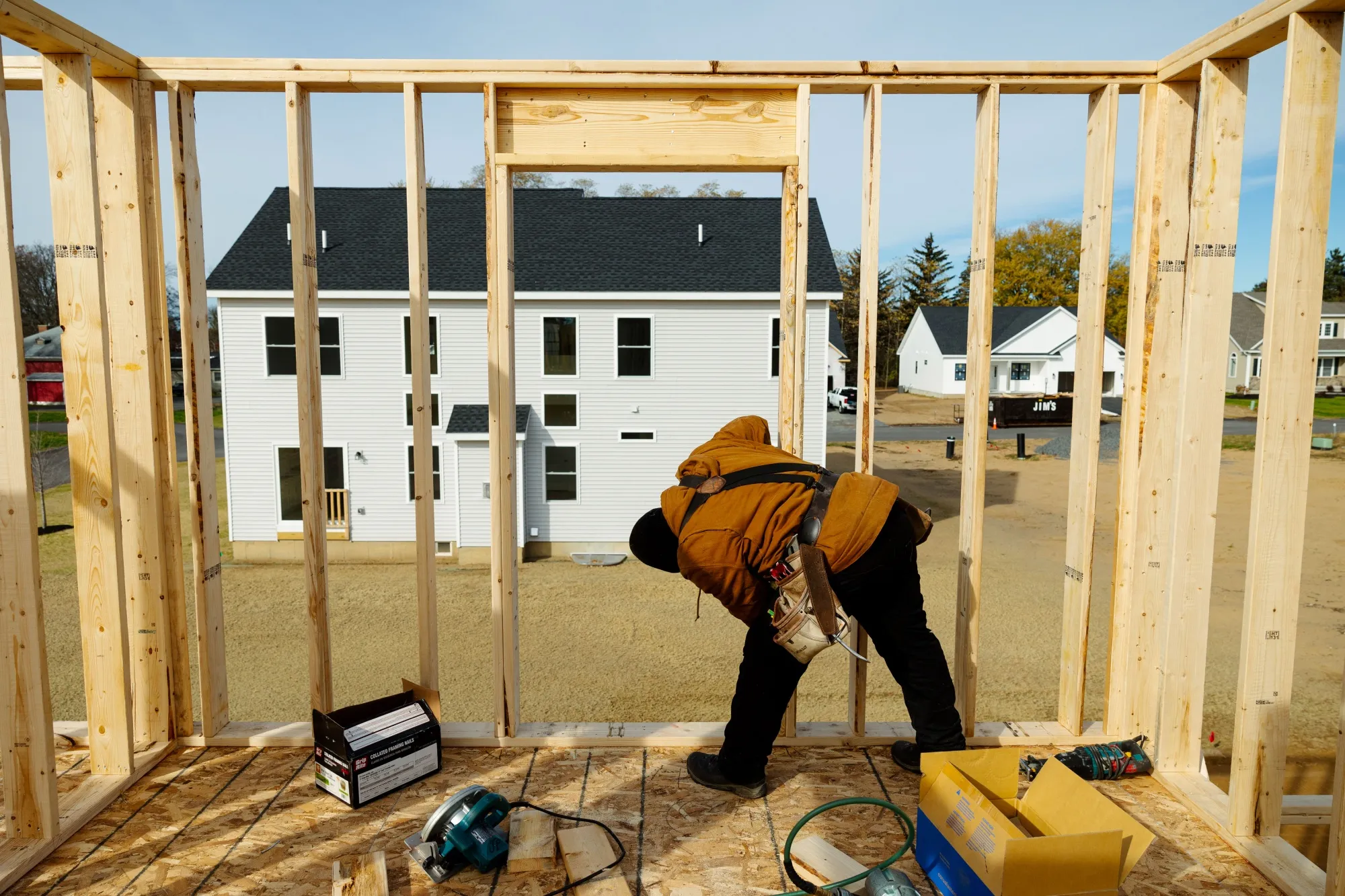 A worker constructs a home in Loudonville, New York, US.