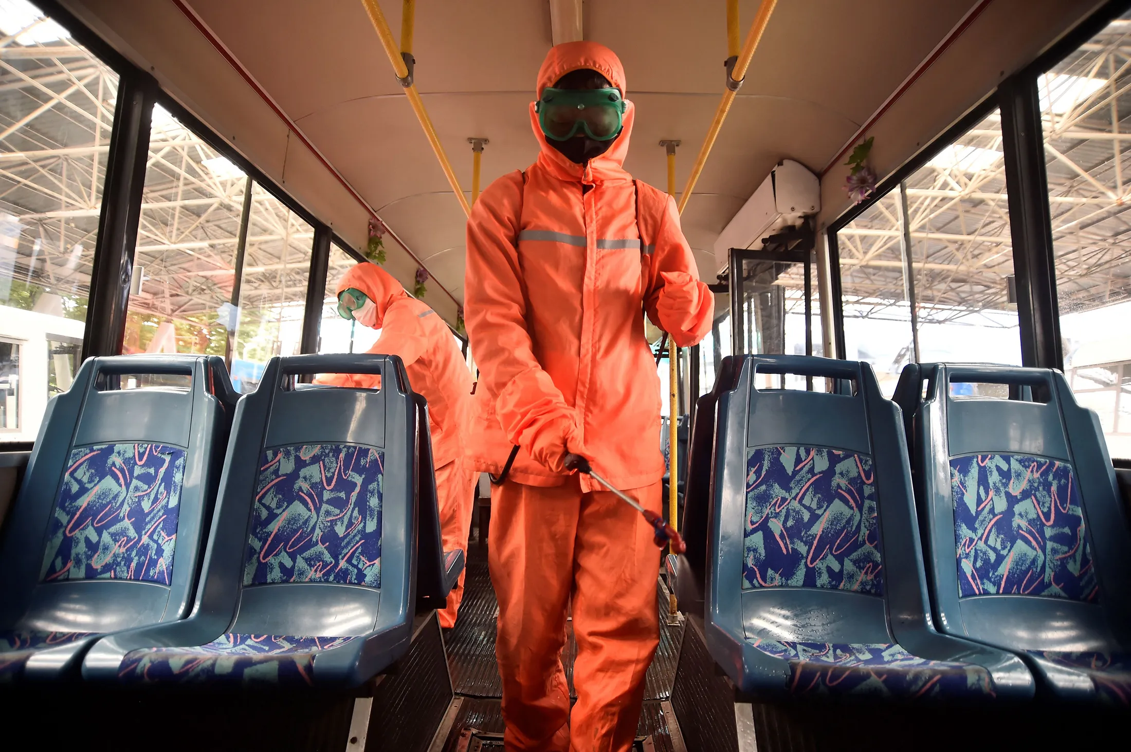 Health officials disinfect a bus in Pyongyang earlier in June. 