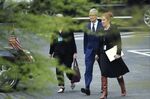 Apple CEO Tim Cook walks to the White.