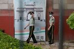 Two Chinese paramilitary police officers patrol outside the Indian embassy in Beijing on June 16, 2020.