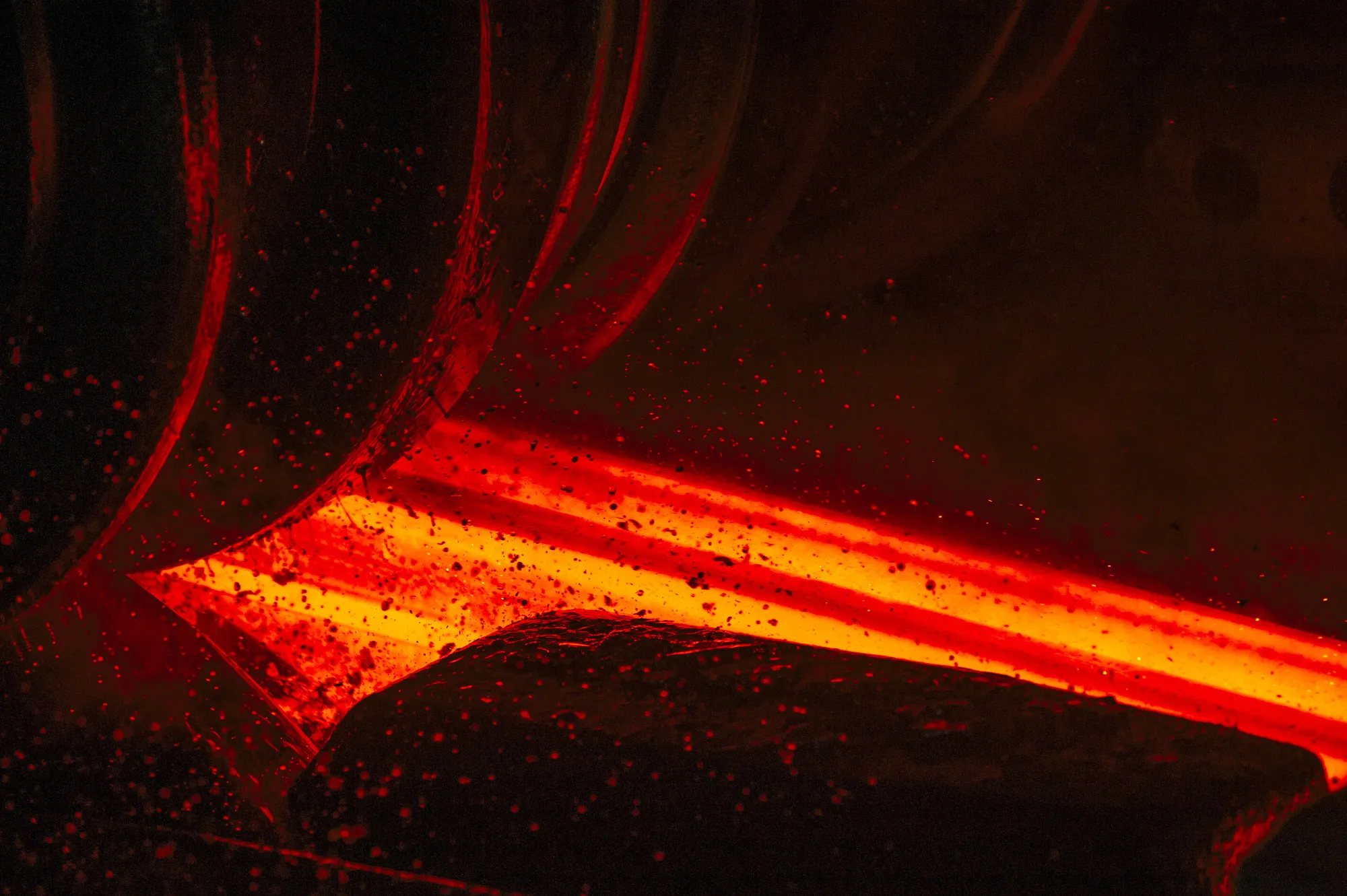 A red hot steel beam is shaped by a rolling machine inside the ArcelorMittal HighVeld Steel & Vanadium Corp. plant in eMalahleni, South Africa, on Tuesday, June 6, 2017. Steelmakers have seen profit buoyed with metal prices at the highest in more than two years in key markets such as the U.S. and Europe.