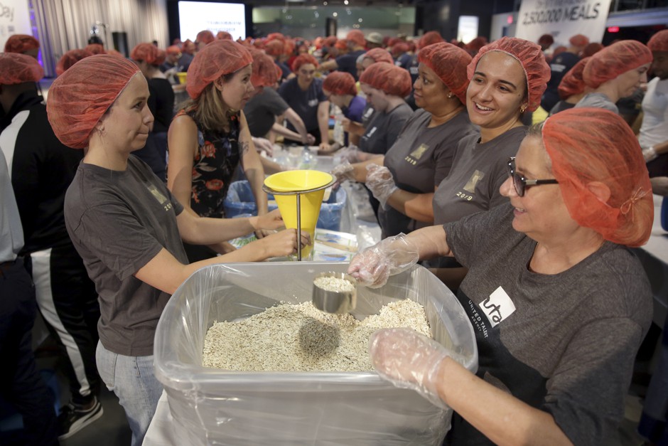Volunteers pack meals during an event in New York on the anniversary of 9/11.