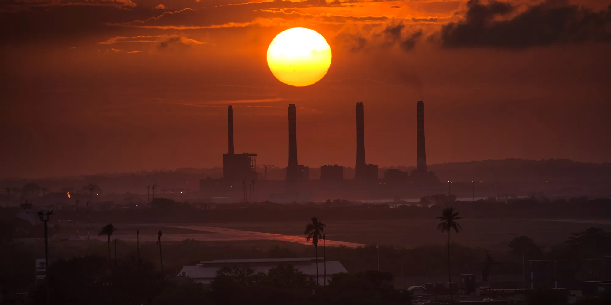The sun sets over an oil refinery in Puerto Cabello, Venezuela.