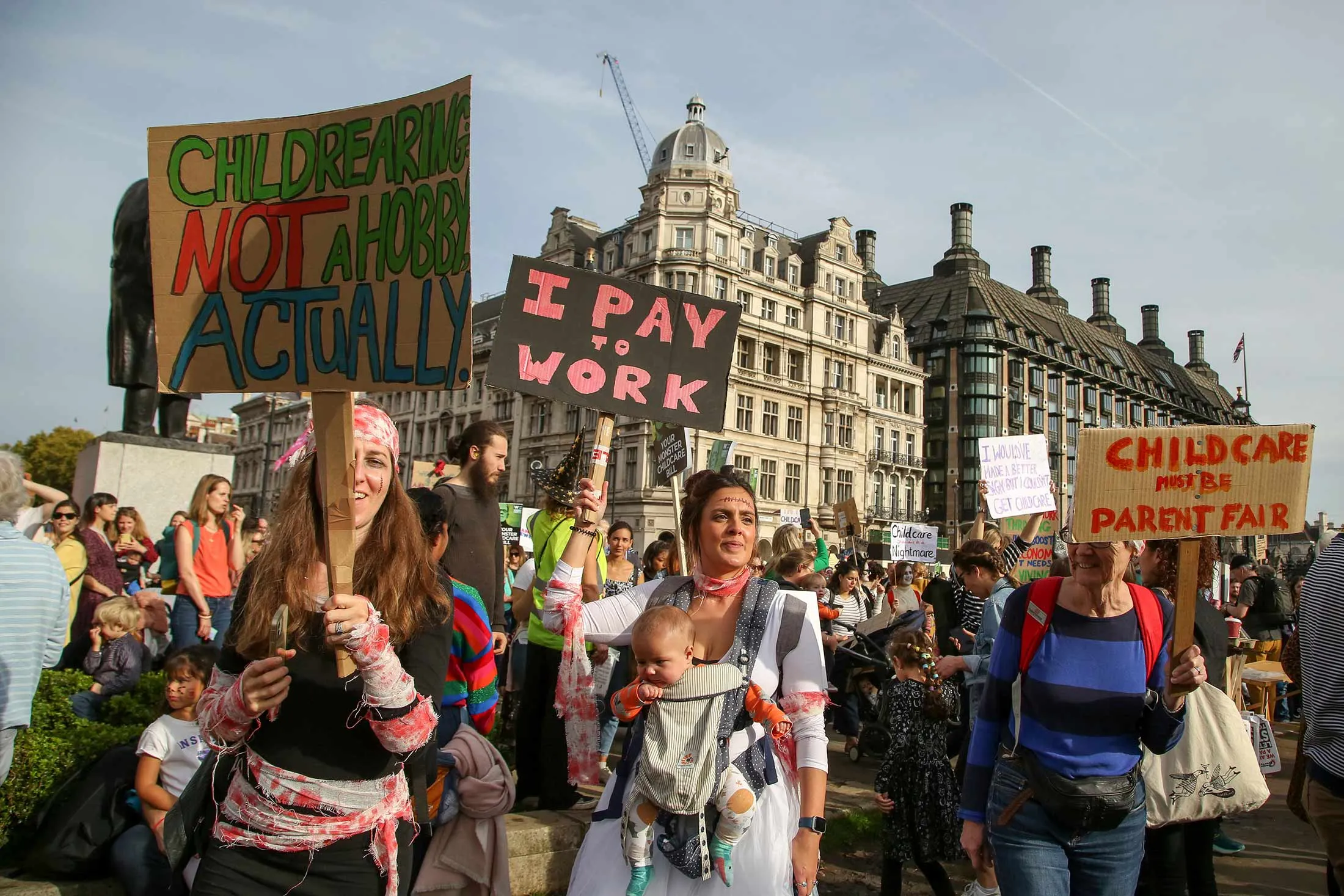 Parents and children at the March of the Mummies protest in London demanding better child-care, parental leave and flexible working policies.
