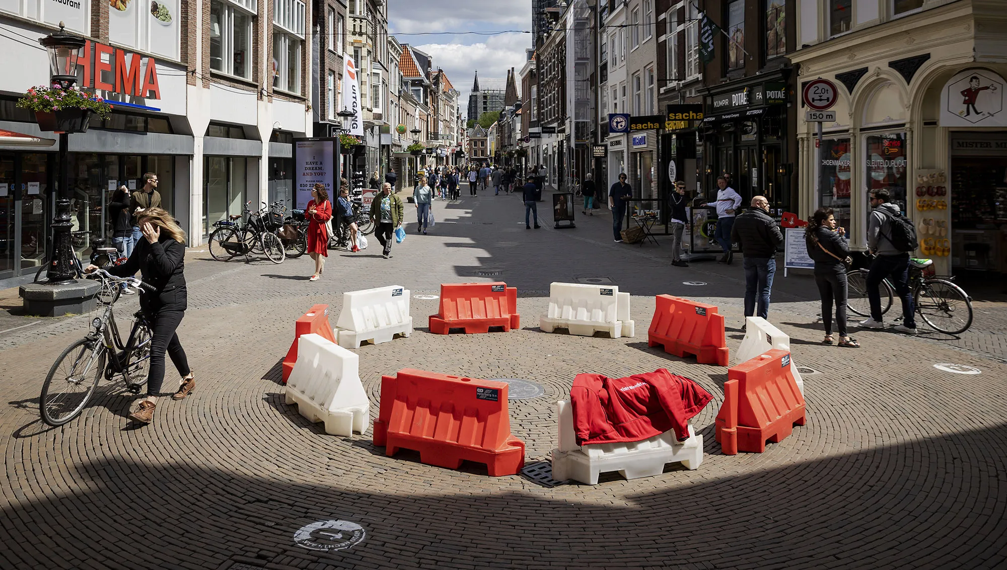 Shoppers walk near a roundabout&nbsp;set up to indicate direction to apply social distancing&nbsp;in downtown Utrecht, the Netherlands&nbsp;on May 17.