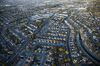 Houses stand in this aerial photograph taken above Alameda, California, U.S., on Monday, Oct. 5, 2015. With tech workers flooding San Francisco, one-bedroom apartment rents have climbed to $3,500 a month, more than in any other U.S. city.