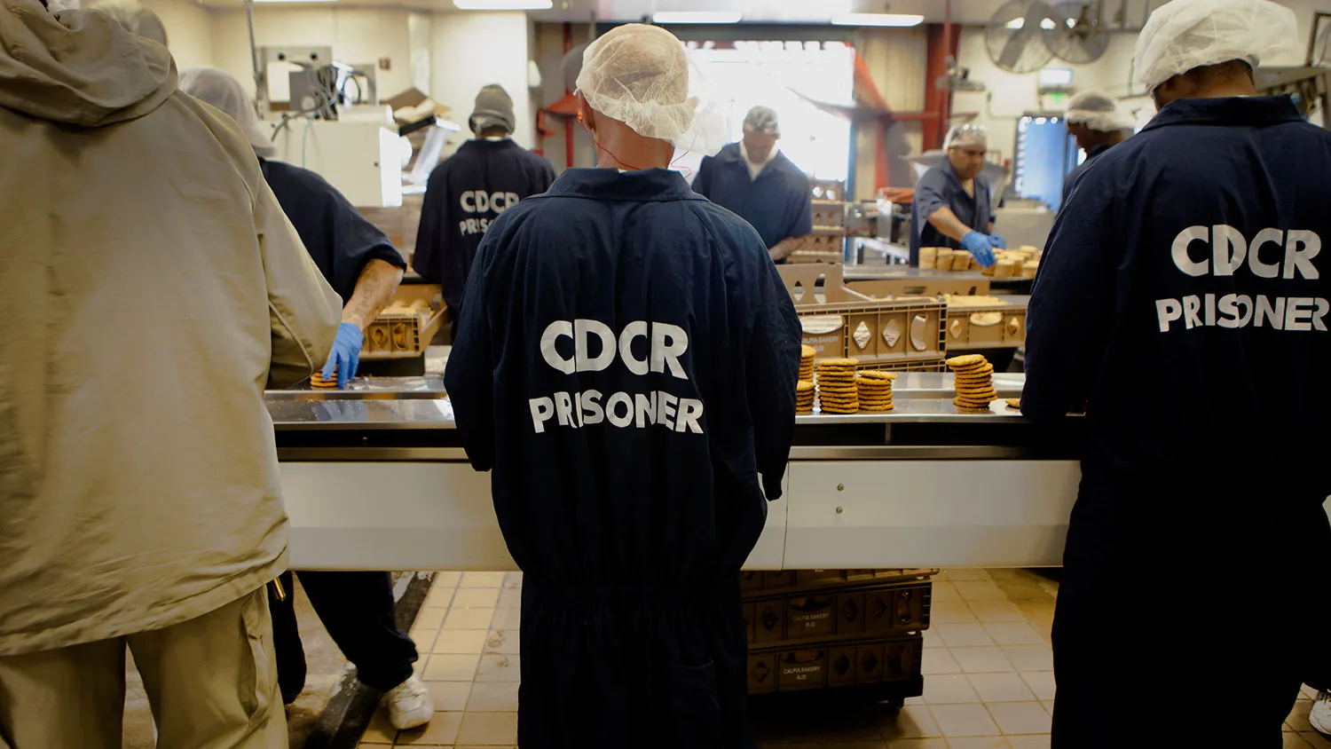 Inmates make cookies in the bakery at the Richard J. Donovan Correctional Facility in San Diego, California, U.S., on Wednesday, March 26, 2014.
