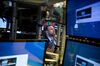 A trader works on the floor of the New York Stock Exchange (NYSE) in New York, U.S., on Monday, April 9, 2018. U.S. stocks climbed with Asian equities as combatants took a break from battle posturing in the trade war and bulls looked to the start of first-quarter earnings season for reassurance.