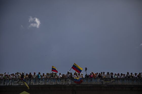 Venezuelans March as Guaido and Maduro Vie for Legitimacy