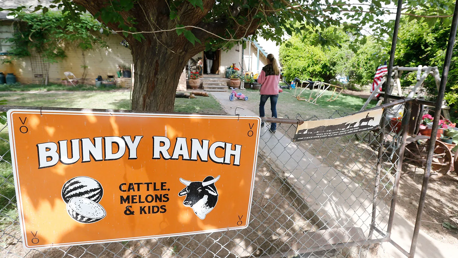 People mill around the outside of rancher Cliven Bundy ranch house on April 11, 2014 west of Mesquite, Nevada.
