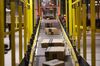 Parcels containing customers' goods ordered online using the 'Prime' service move along an automated conveyor belt at Amazon.com Inc.'s new fulfillment center in Kolbaskowo, Poland, on Friday, Feb. 16, 2018. Both academic and commercial roboticists have been putting a lot of energy into solving what’s sometimes referred to as the “picking” challenge, and Amazon is trying to direct that energy towards its specific needs.