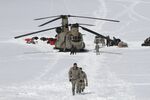  Capt. Corey Wheeler, front, commander of B Company, 1st Battalion, 52nd Aviation Regiment at Fort Wainwright, Alaska, walks away from a Chinook helicopter that landed on the glacier near Denali, April 24, 2016, on the Kahiltna Glacier in Alaska. The U.S. Army helped set up base camp on North America's tallest mountain. The U.S. Army is poised to revamp its forces in Alaska to better prepare for future cold-weather conflicts, and it is expected to replace the larger, heavily equipped Stryker Brigade there with a more mobile, infantry unit better suited for the frigid fight, according to Army leaders. (AP Photo/Mark Thiessen, File)