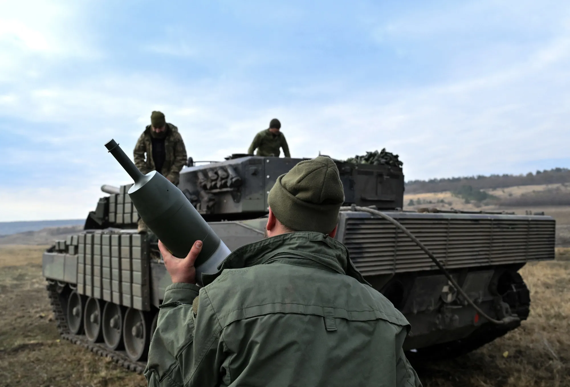 Ukrainian Ground Force tankers&nbsp;load projectiles onto a Leopard 2A4 tank during a field training in Ukraine on Oct. 27.