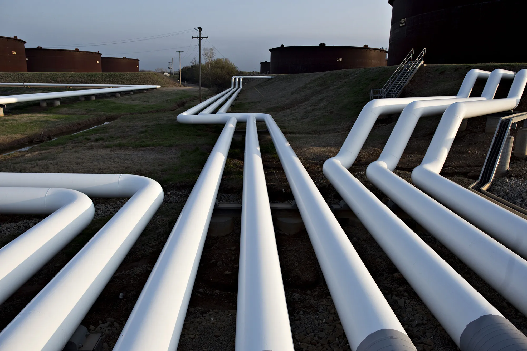 Pipelines run near oil storage tanks in Cushing, Oklahoma.