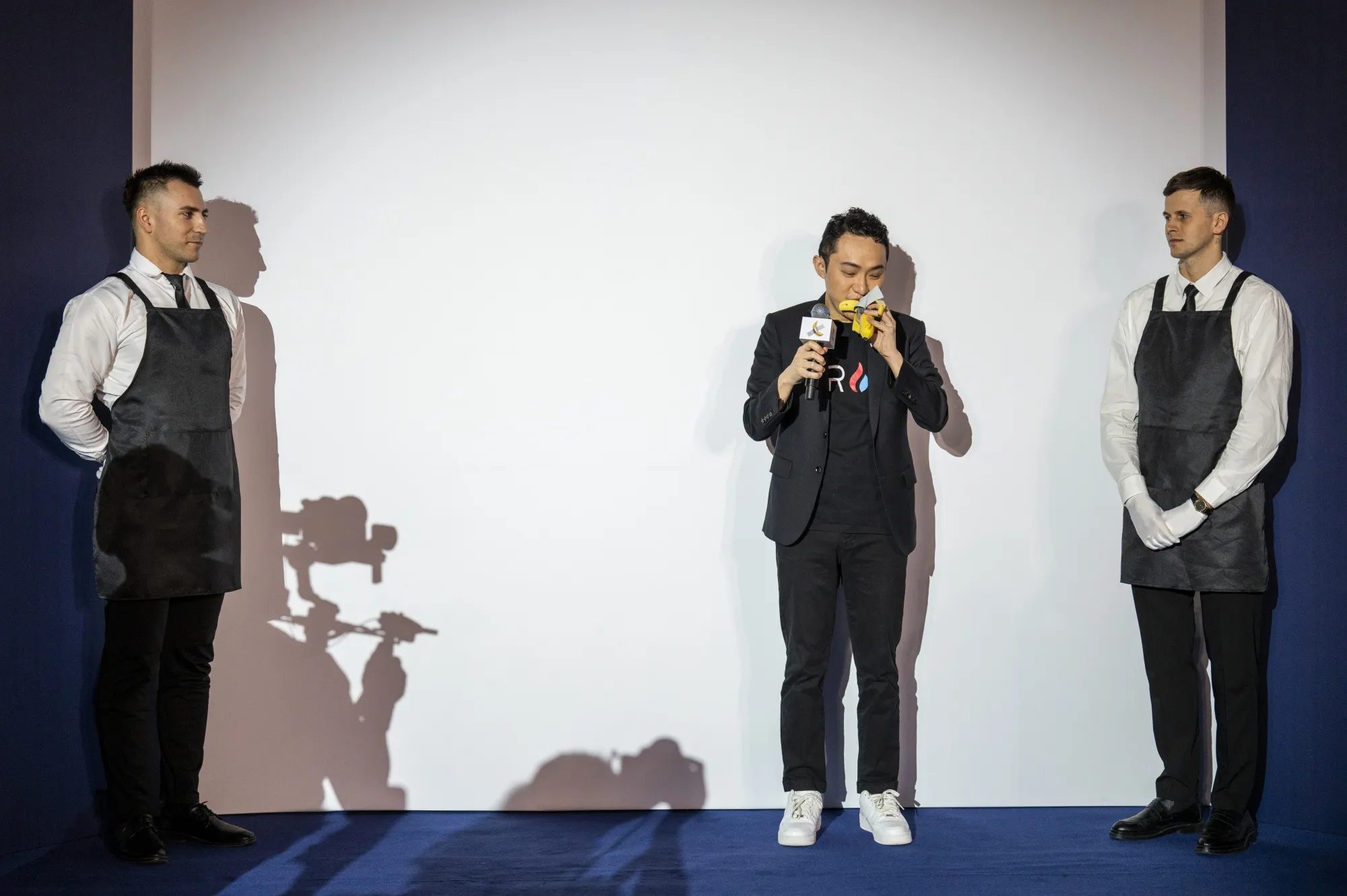 Justin Sun eats a banana that forms part of the artwork “Comedian” in Hong Kong on Nov. 29.