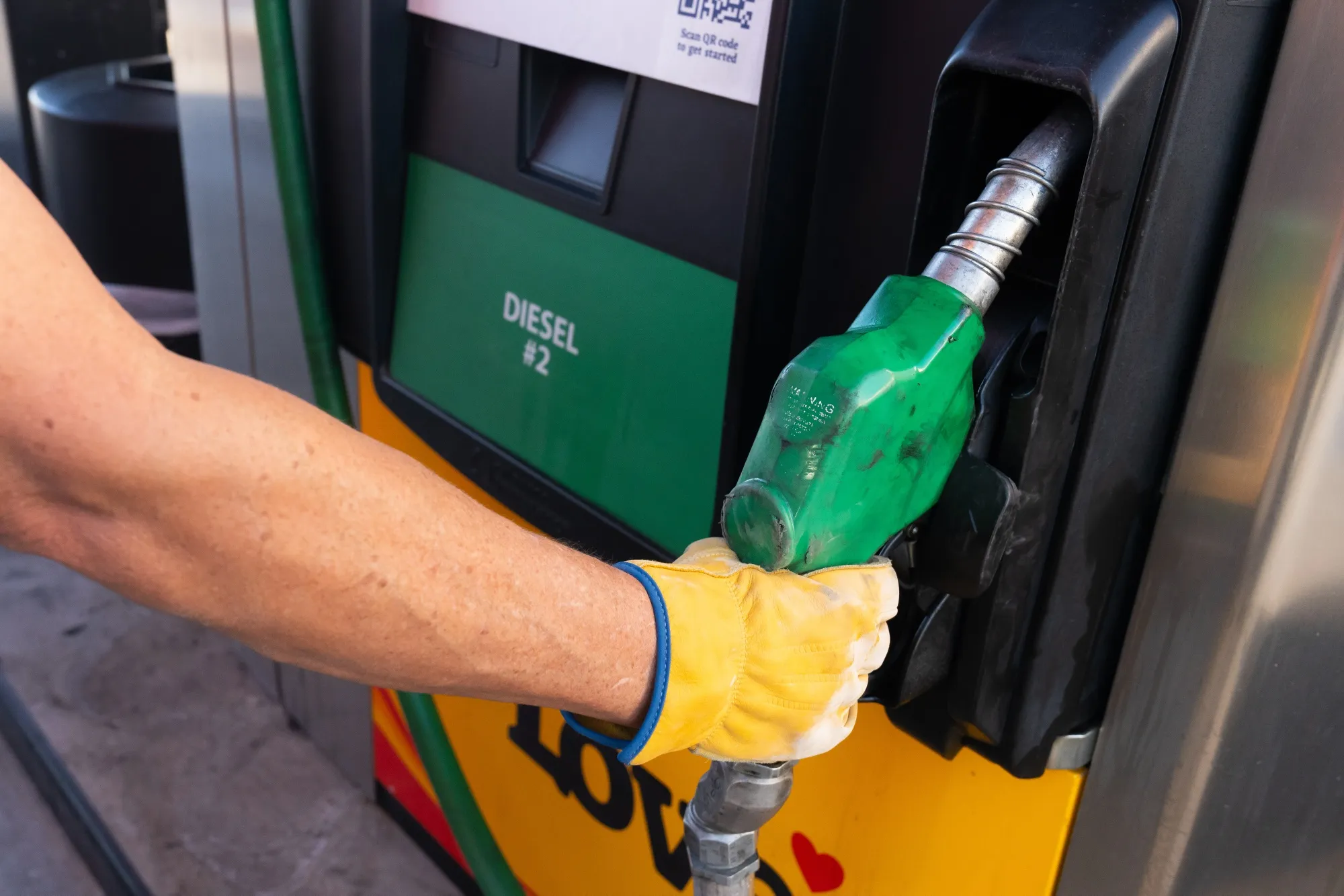 A semi truck driver replaces a diesel fuel pump at a Love’s gas station in Eloy, Arizona on March 18.
