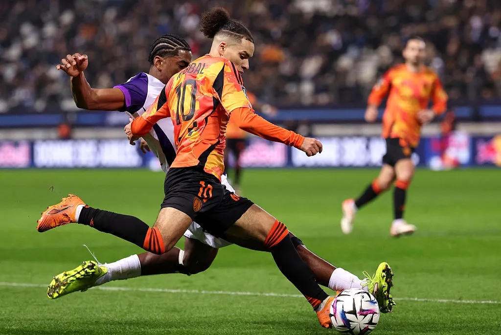 Paris FC's midfielder Ilan Kebbal (R) fights for the ball with Toulouse's defender Dayann Methalie in December.