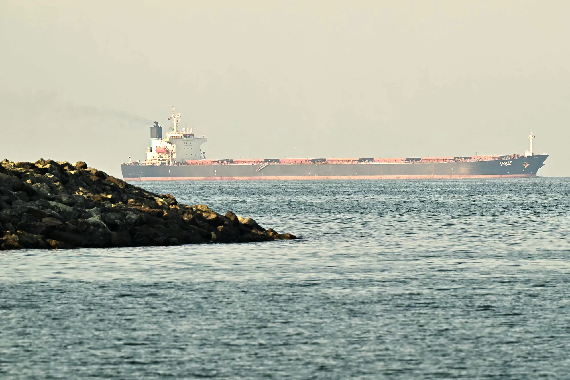 A cargo ship is pictured off coast city of Fujairah, in the Strait of Hormuz.