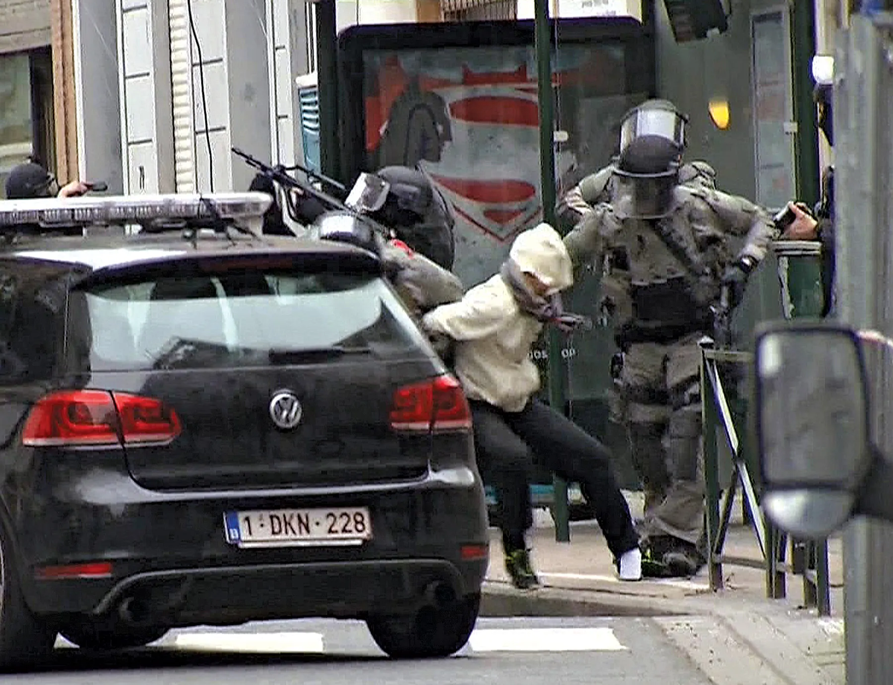 Salah Abdeslam is arrested by police and bundled into a police vehicle during a raid in the Molenbeek neighborhood of Brussels on March 18.
