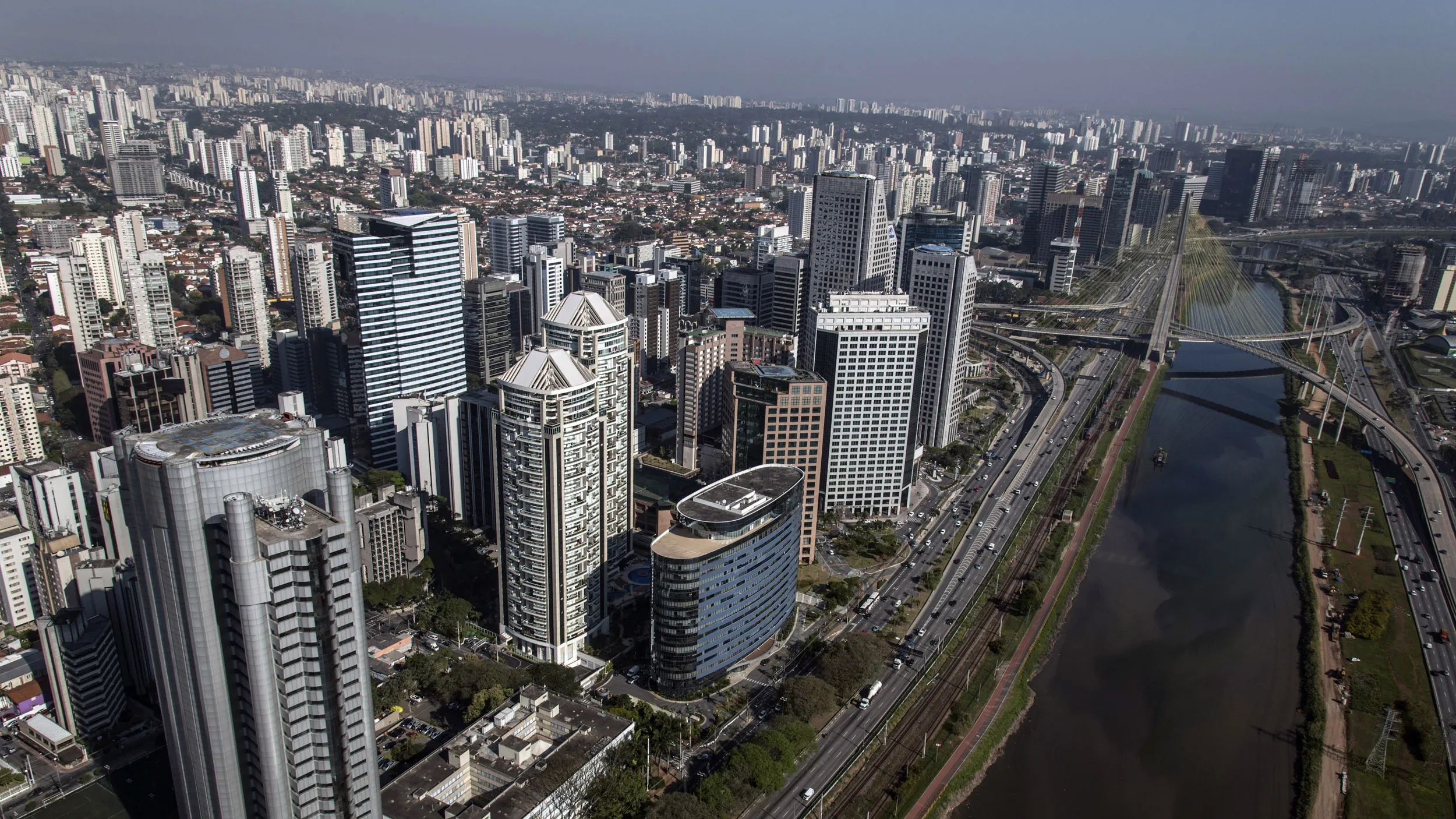 The financial district, left, is seen in this aerial photograph taken in Sao Paulo, Brazil, on Thursday, Aug. 29, 2013.
