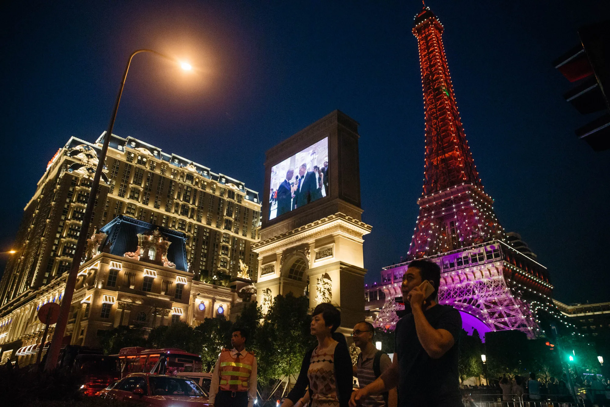 The Eiffel Tower attraction, a half-size replica of the Eiffel Tower in Paris, stands illuminated at the Parisian Macao casino resort in Macau.