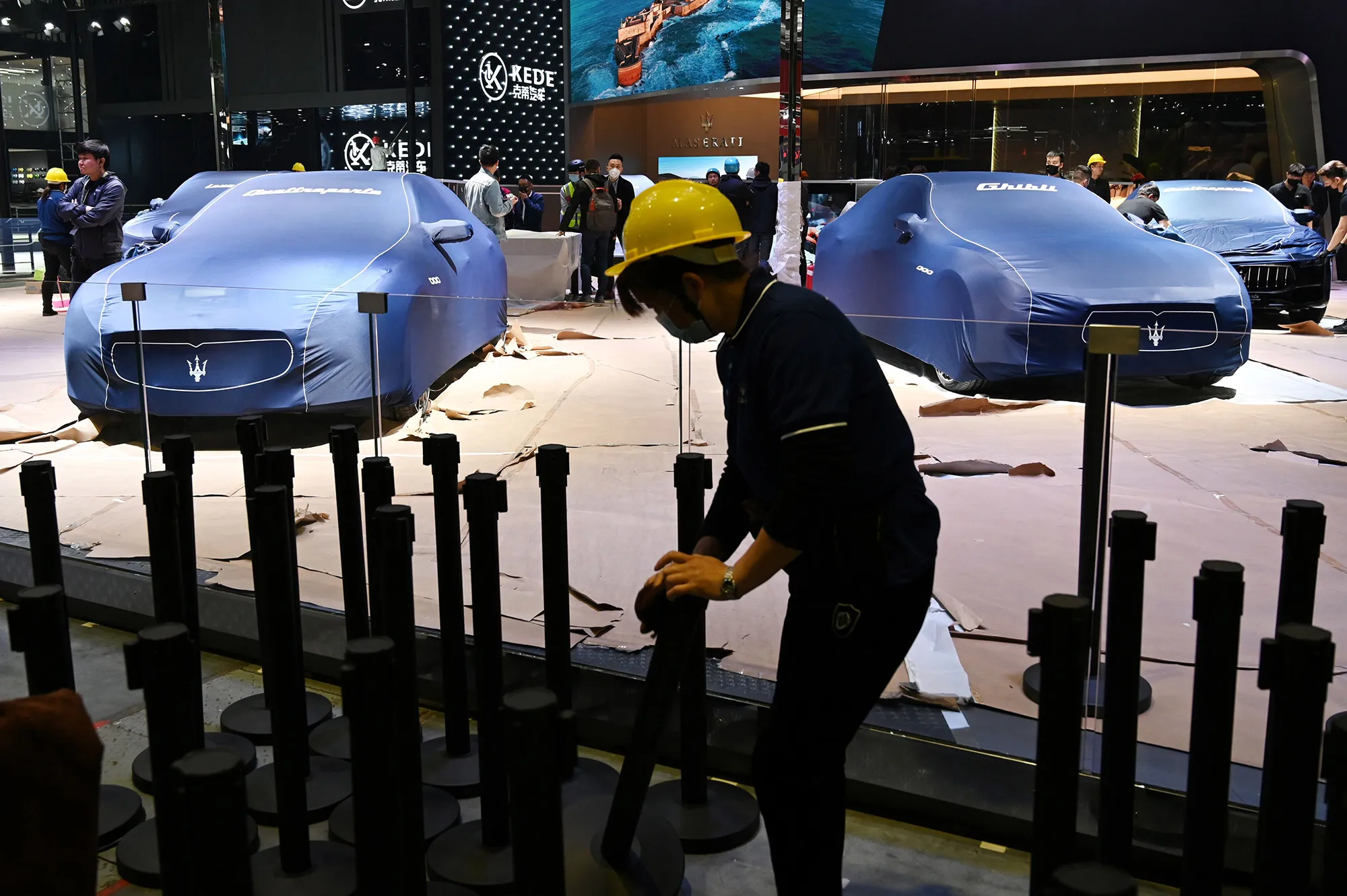 Workers set up display stands a day before the opening of the Shanghai Auto Show.&nbsp;