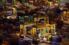 Stacked containers sit among gantry cranes illuminated at night at Tanjong Pagar Container Terminal, operated by PSA International Pte, at the Port of Singapore in Singapore, on Thursday, Sept. 15, 2016. Singapore's non-oil exports - the most commonly-used gauge for trade performance – are estimated to fall 3.1 percent in August after they dropped 10.6 percent in July from a year earlier.