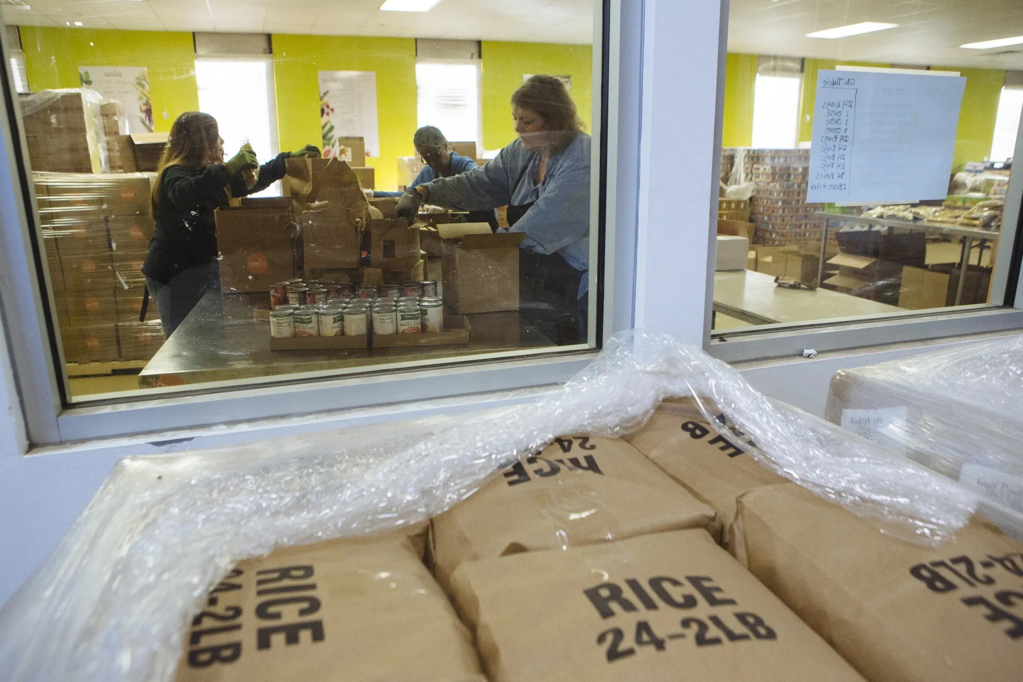 Packing home delivery boxes at a food bank distribution center in Elmsford, N.Y., on March 16.