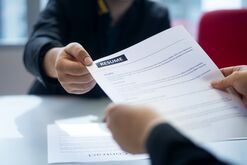 Recruitment, Job application, contract and business employment concept. Hand giving the resume to the recruiter to review the profile of the applicant.