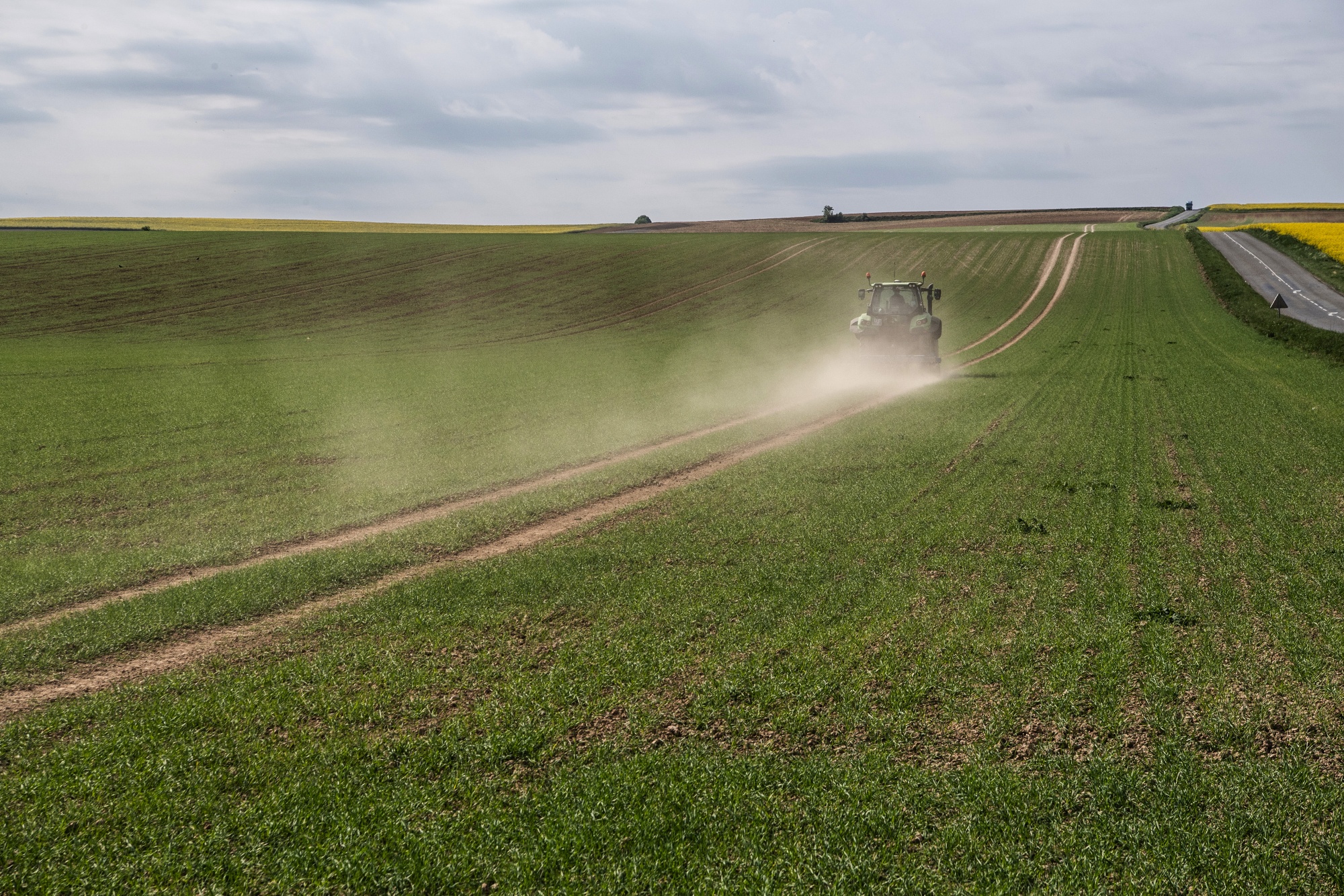 A tractor kicks up dust at a farm&nbsp;during drought conditions,&nbsp;in Aisne, France, in April.