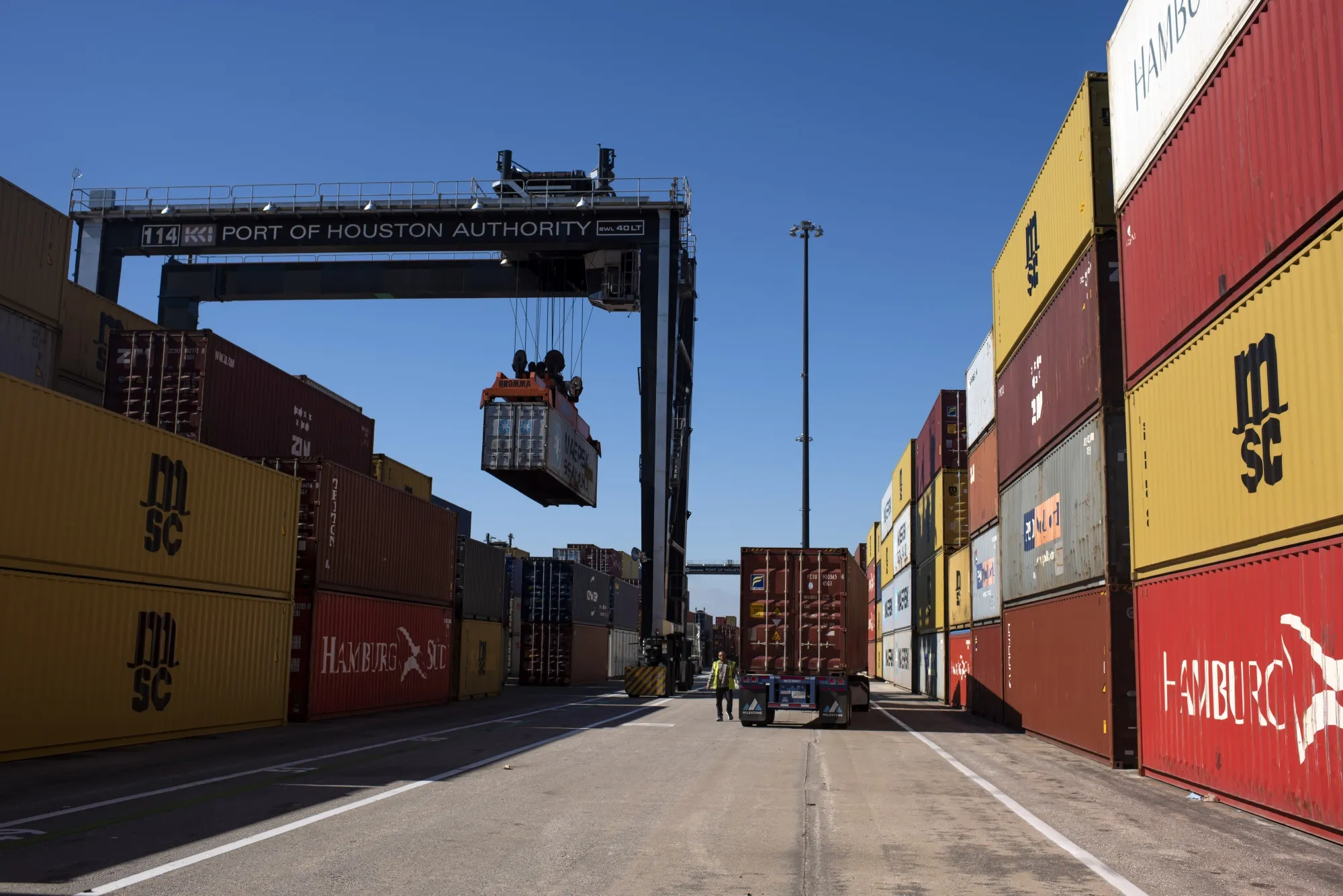 Containers are loaded onto trucks at the Port of Houston in Seabrook, Texas.