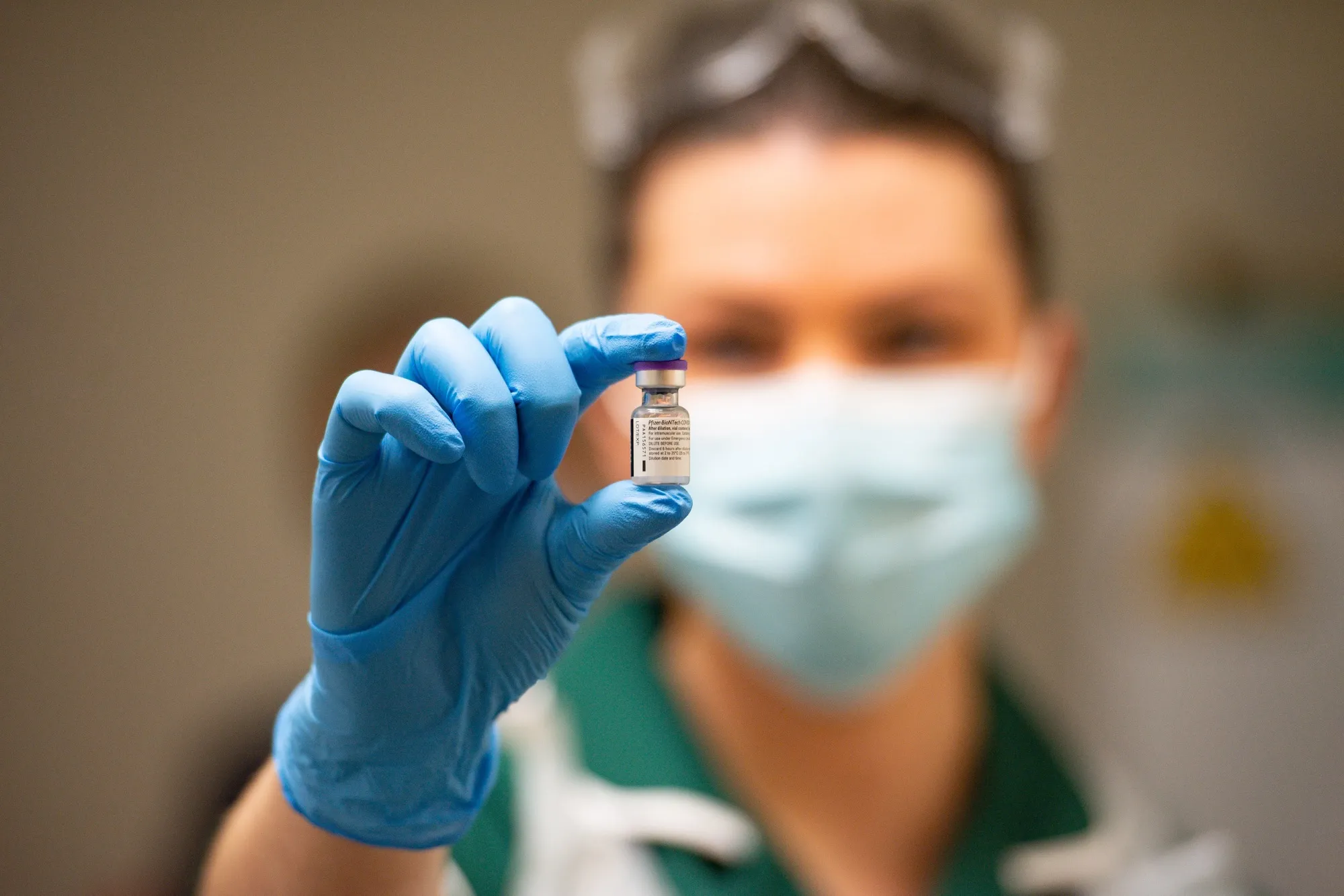 A nurse holds a vial of the Covid-19 vaccine at University Hospital in Coventry.