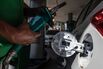 A worker refuels a vehicle at a gas station in Sao Paulo, Brazil.