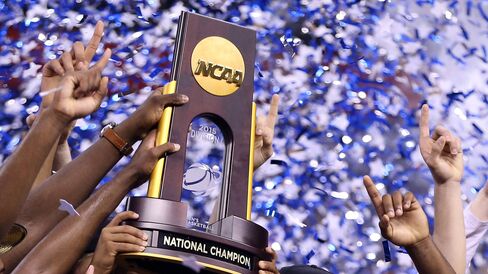 The Duke Blue Devils hold up the championship trophy after defeating the Wisconsin Badgers in the NCAA title game on April 6 at Lucas Oil Stadium in Indianapolis.