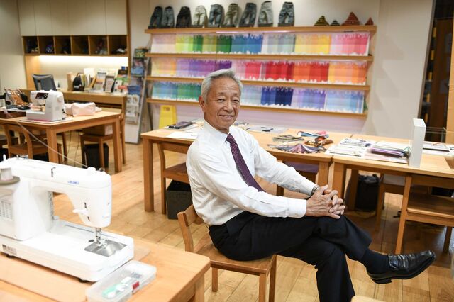 Sarumaru sits in a sewing room at the YKK public space in Tokyo.
