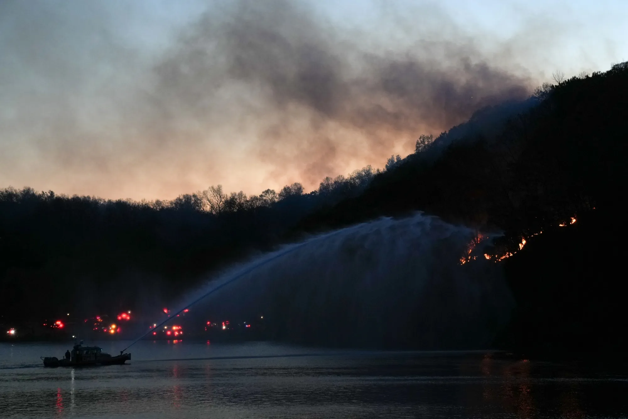 A New York City Fire Department boat works to put out a brush fire in Inwood Hill Park in Manhattan, New York,&nbsp;on Nov. 13.