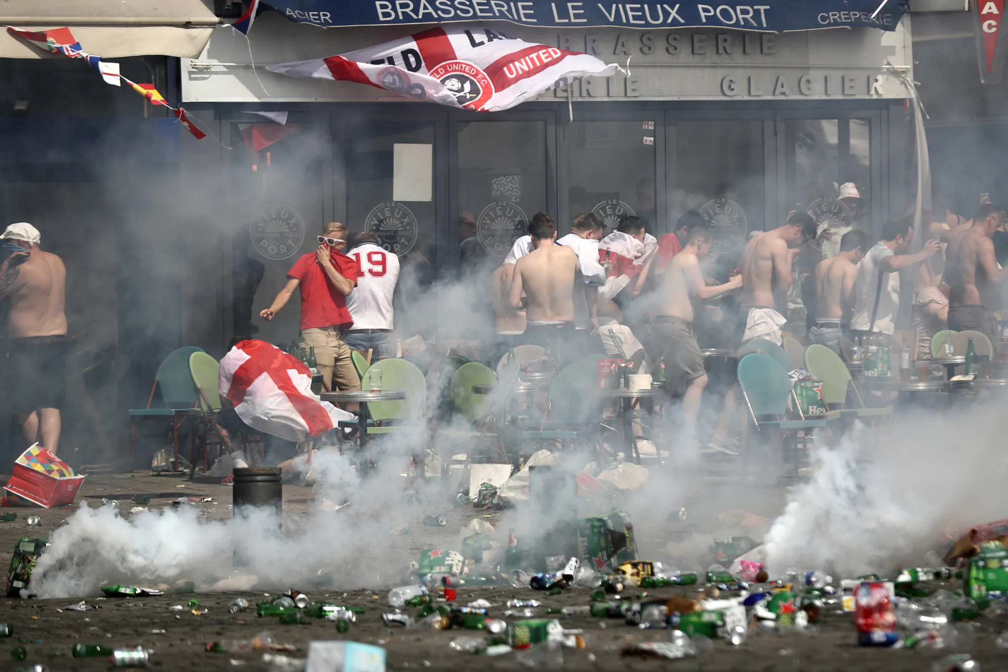 MARSEILLE, FRANCE - JUNE 11: England fans react after police sprayed tear gas during clashes ahead of the game against Russia later today on June 11, 2016 in Marseille, France. Football fans from around Europe have descended on France for the UEFA Euro 2016 football tournament.

